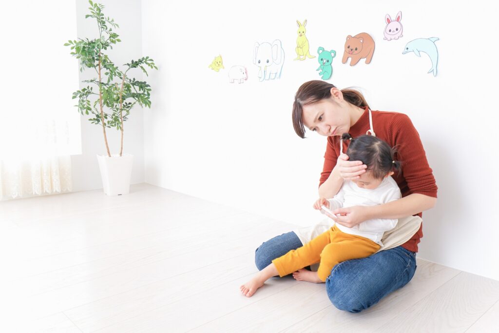 園児を抱いている園長先生